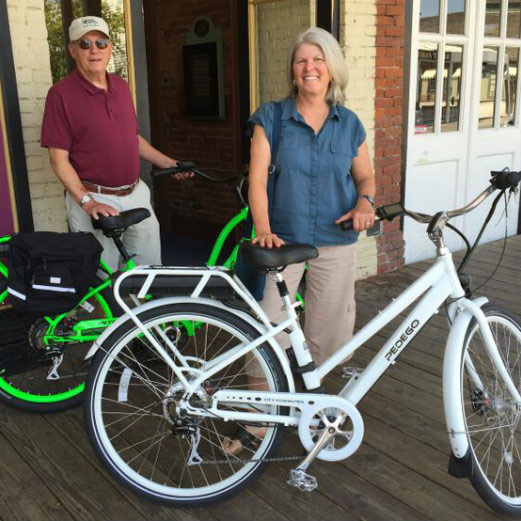 Chris and his wife on pedego interceptors