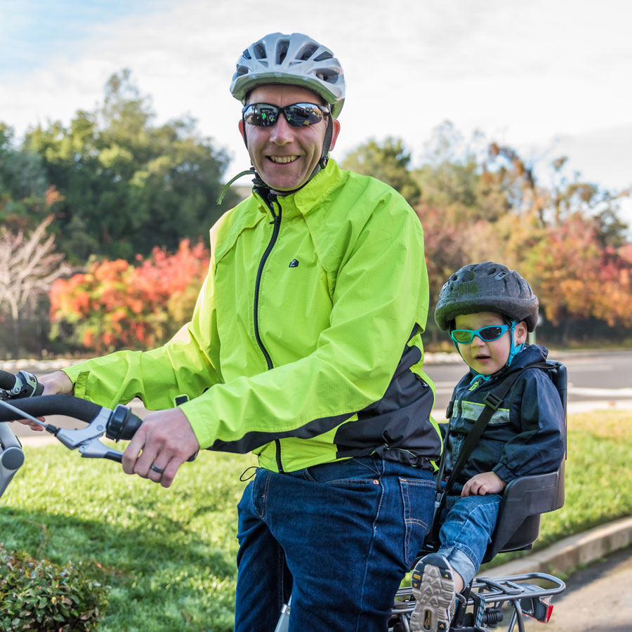 Father and child on electric bike