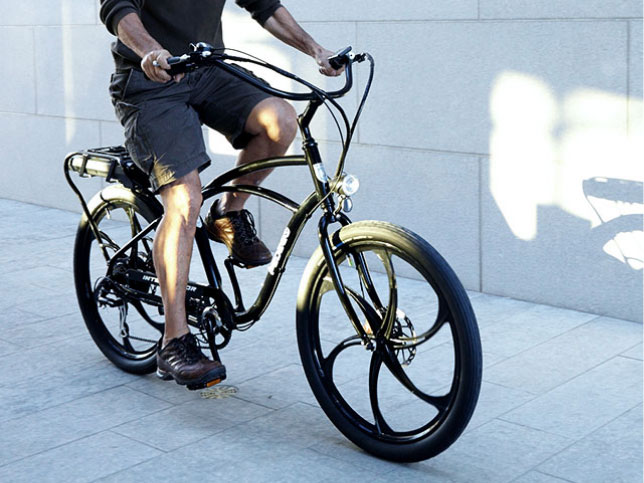 Man riding electric bike with mag wheels