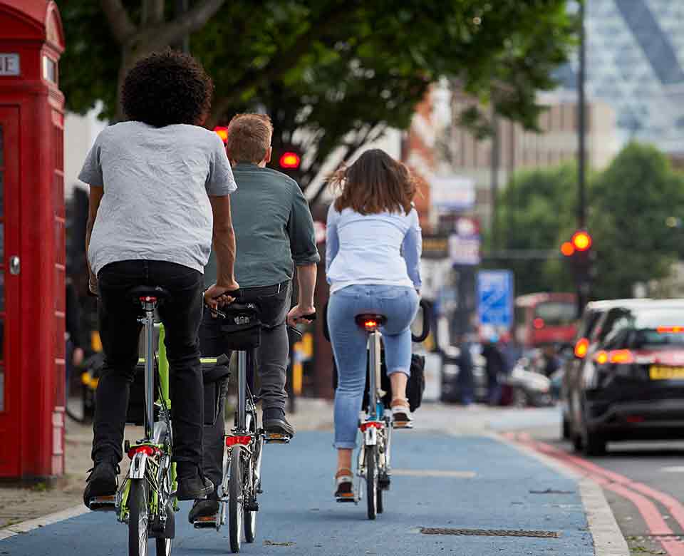 People biking on brompton folding bikes