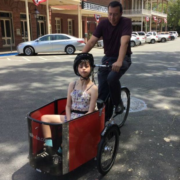 father and daughter with bikes