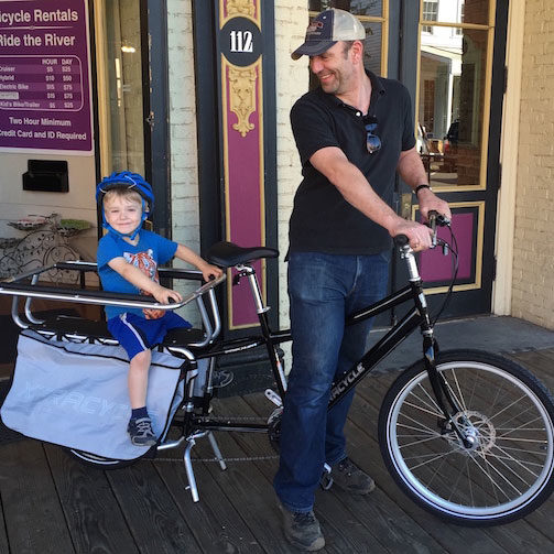 Father and son in xtracycle bike