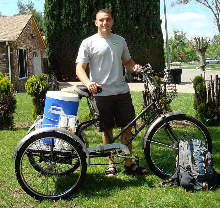 man carrying lemonade on bike